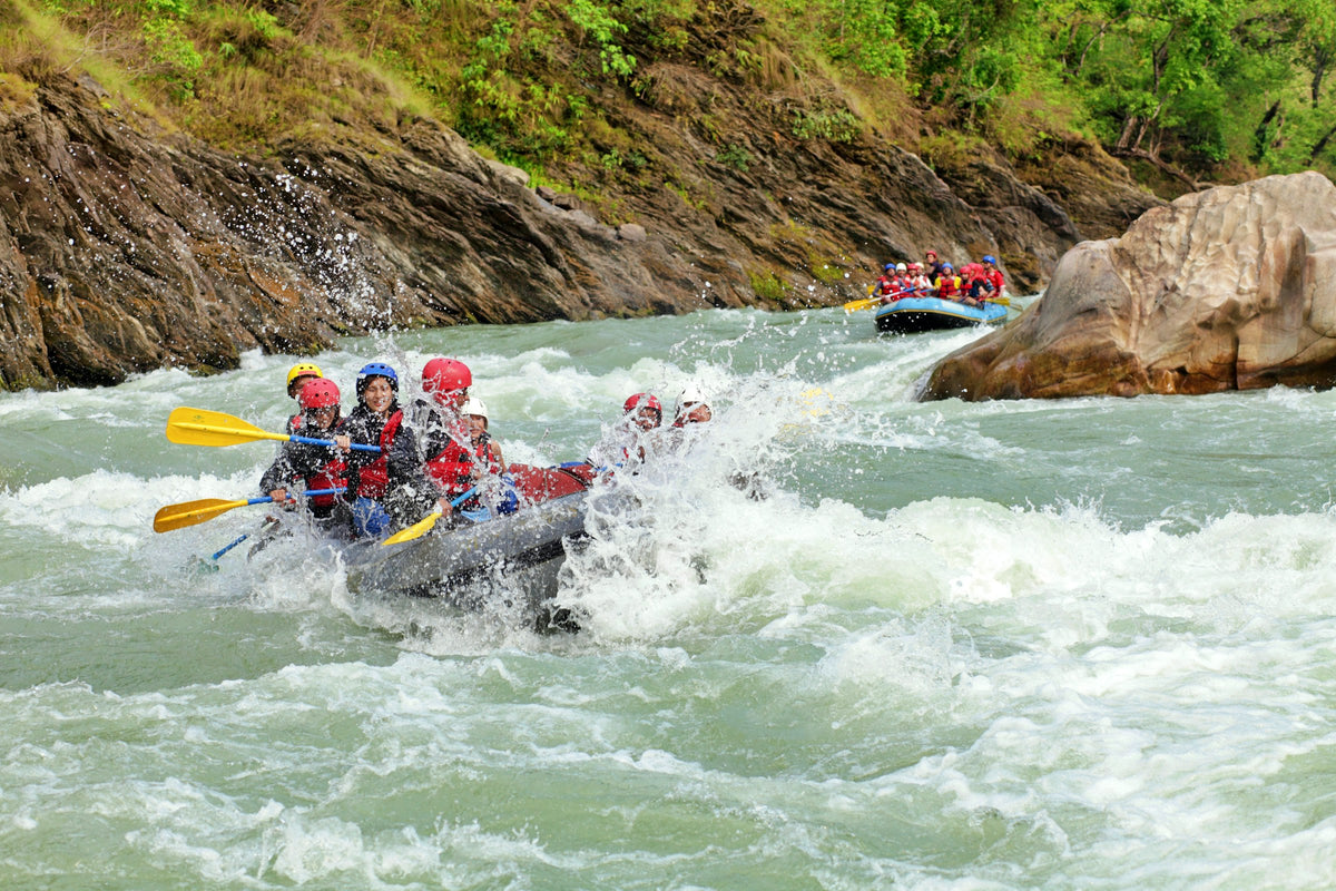 A group white-water rafting down a river