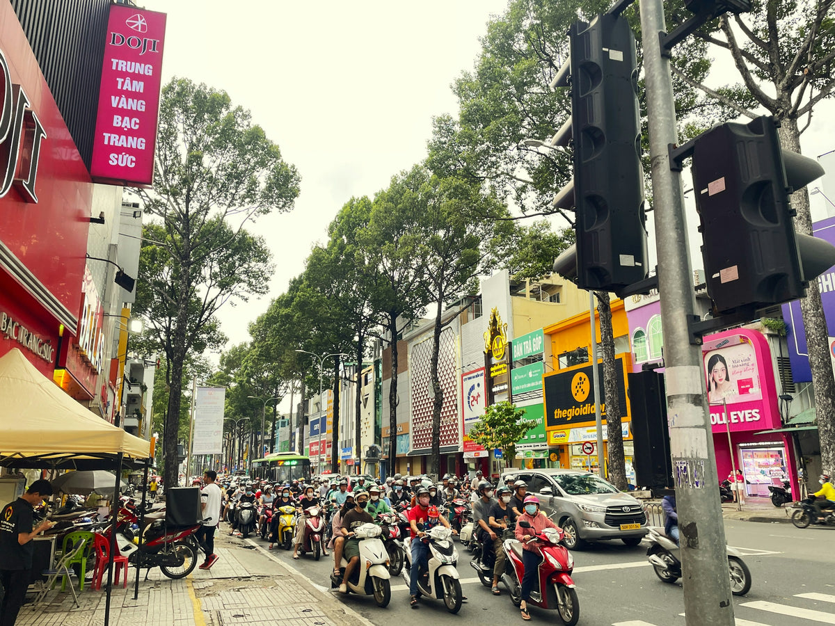 Motorbikes filling a typical street in Ho Chi Minh City, Vietnam